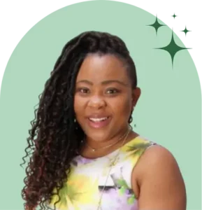 Smiling woman with long curly hair, green background.